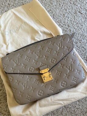 Louis Vuitton Taupe Monogram Embossed Pochette with Gold-Tone Lock